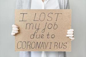 Job loss due to COVID-19 virus pandemic concept. Unrecognizable person holds sign I lost my job
