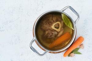 Paleo bone broth diet, beef meat soup. Low-carb food, keto recipe. photo