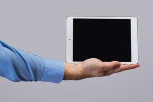 White tablet pc in hands photo