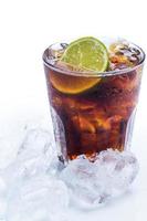 Fresh cocktail with cola drink and lime photo