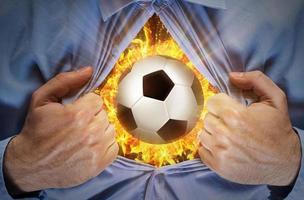 Burning soccer ball behind a shirt