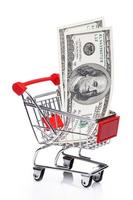 Banknotes in small shopping trolley photo