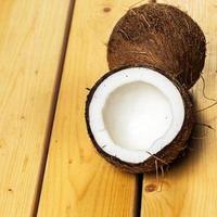 Fresh coconuts on wooden background photo