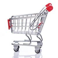 Shopping trolley on white background photo