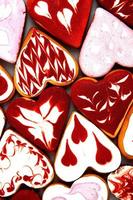 galletas del día de san valentín. galletas en forma de corazón para el día de san valentín. galletas en forma de corazón rojo y rosa. romántico de patrones sin fisuras con corazones de galletas. foto