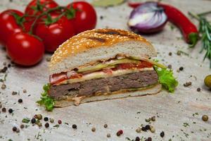 Top view hamburger on the wooden background . Hamburger, homemade hamburger with fresh vegetables.Beef burger. photo