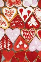 Valentine  day cookies. Heart shaped cookies for valentine day. Red and Pink Heart Shaped Cookies. Romantic seamless pattern with cookies hearts. photo