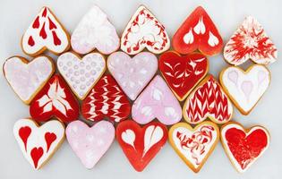 Valentine  day cookies. Heart shaped cookies for valentine day. Red and Pink Heart Shaped Cookies. Romantic seamless pattern with cookies hearts. photo