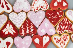 Valentine  day cookies. Heart shaped cookies for valentine day. Red and Pink Heart Shaped Cookies. Romantic seamless pattern with cookies hearts. photo