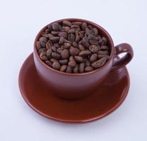 Cup of coffee on the coffee beans background photo