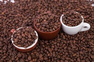 Cup of coffee on the coffee beans background photo