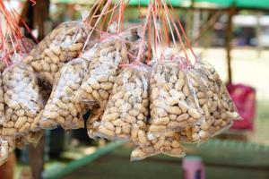 Roasted peanuts in a plastic bag photo