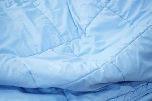 blue blanket background on the mattress photo