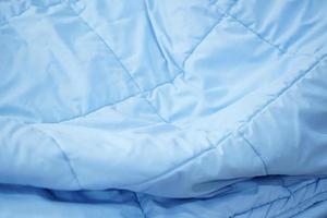 blue blanket background on the mattress photo