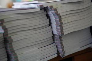 Book stack on wood desk photo