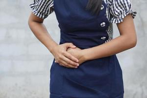 Woman suffer from stomachache.Chronic gastritis. Abdomen bloating concept photo
