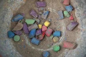 colored old used chalk in a bucket photo