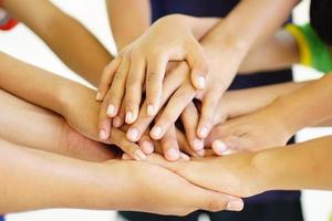 High five team work as a team together, air hands bless the power tag team. Multi-ethnic groups Unity together in the volunteer community. Cooperation Business team success concept. photo