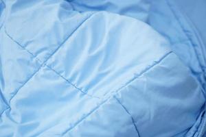 blue blanket background on the mattress photo