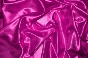 abstract purple fabric background with soft waves photo