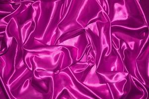 abstract purple fabric background with soft waves photo