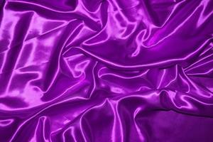 abstract purple fabric background with soft waves photo