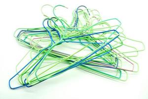 multi colored hangers on a white background photo