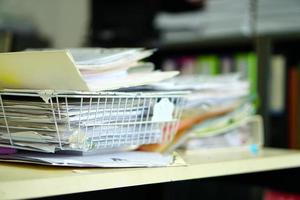 stack of papers on the desk photo