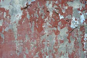 old iron background with peeling paint photo