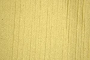 Paper brown texture light rough textured spotted blank copy space background in yellow photo