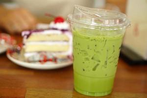 Green tea and cake on a table in a cafe photo