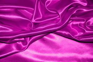 abstract purple fabric background with soft waves photo