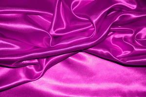 abstract purple fabric background with soft waves photo