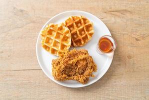 fried chicken waffle with honey or maple syrup photo