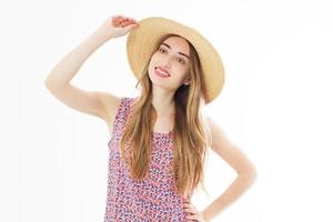 Portrait of a happy cheerful blonde girl in summer hat isolated over white background photo