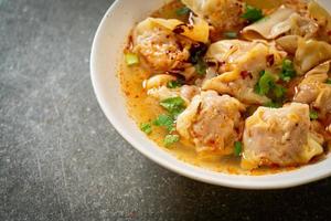 pork wonton soup or pork dumplings soup with roasted chili photo