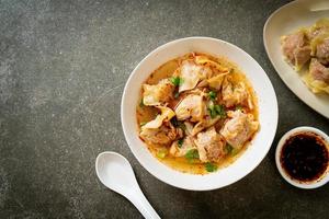 pork wonton soup or pork dumplings soup with roasted chili photo