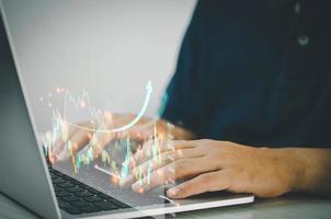 Man hands using computers to analyze data and investment charts. Financial trading plans and digital banking technology marketing. photo