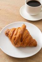 fresh croissant on white plate photo