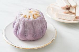 taro bun with white sugar cream and nut photo