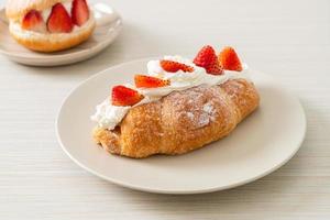 strawberry fresh cream croissant on plate photo