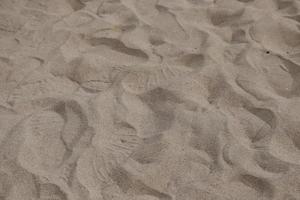 background image of red sand on the beach photo