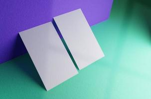 Double business card leaning against the wall mockup template