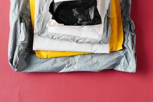 top view of delivery packages on red background photo