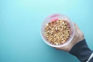 Processed pea nuts in a bowl on table top down . photo