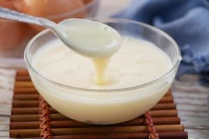 condensed milk in a bowl close up, photo