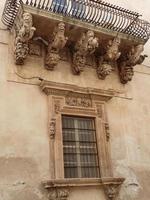 view of an old house facade in italy in summer photo