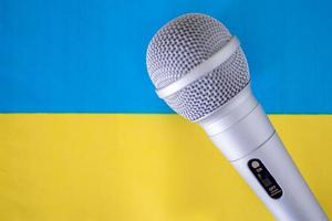 Microphone with national flag on background series - Ukraine photo