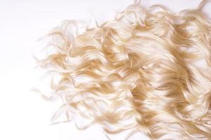 curly blond hair on white background photo