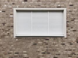 closed window with rolling shutters or roller blinds
